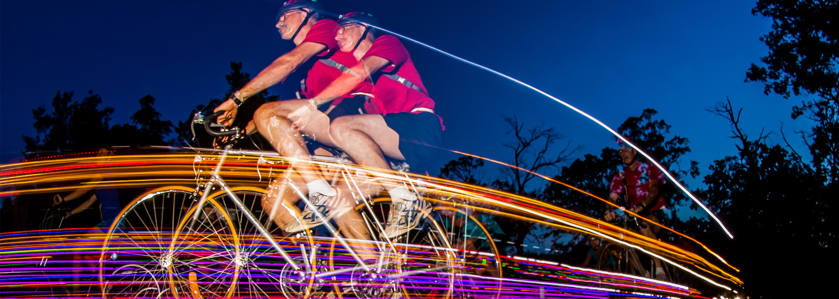 Photo of a rider with lights on their bike at the Virginia Credit Union Moonlight Ride