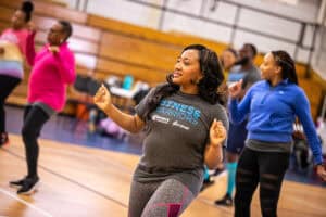 A woman dances during a Fitness Warriors exercise class