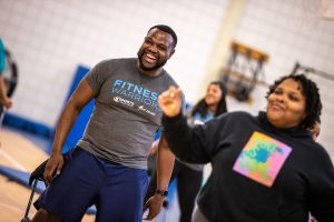 People smiling during a Fitness Warriors exercise class
