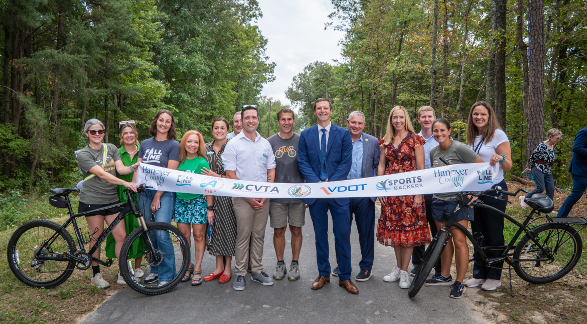 Sports Backers representatives celebrate the Hanover Fall Line trail