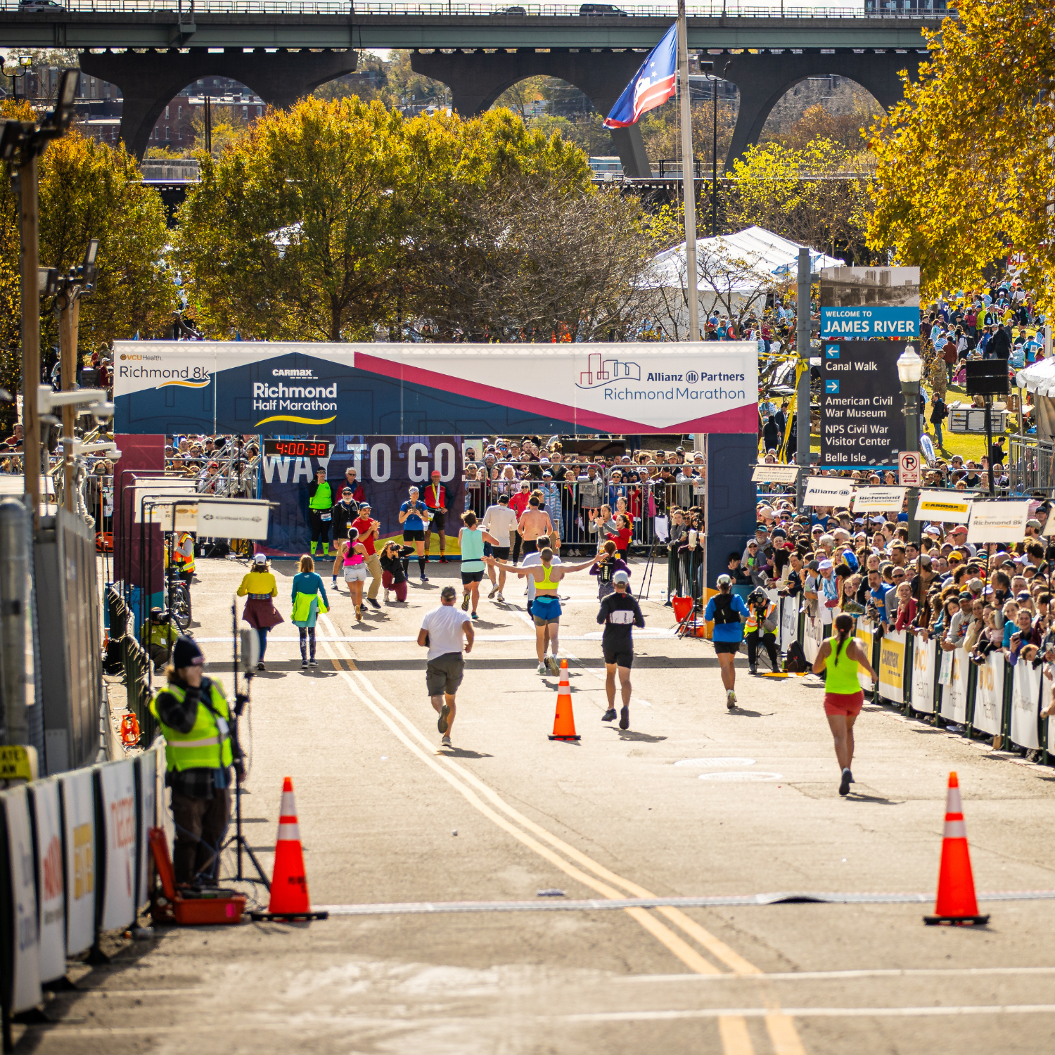 Runners cross the famous downhill finish at the Allianz Richmond Marathon.